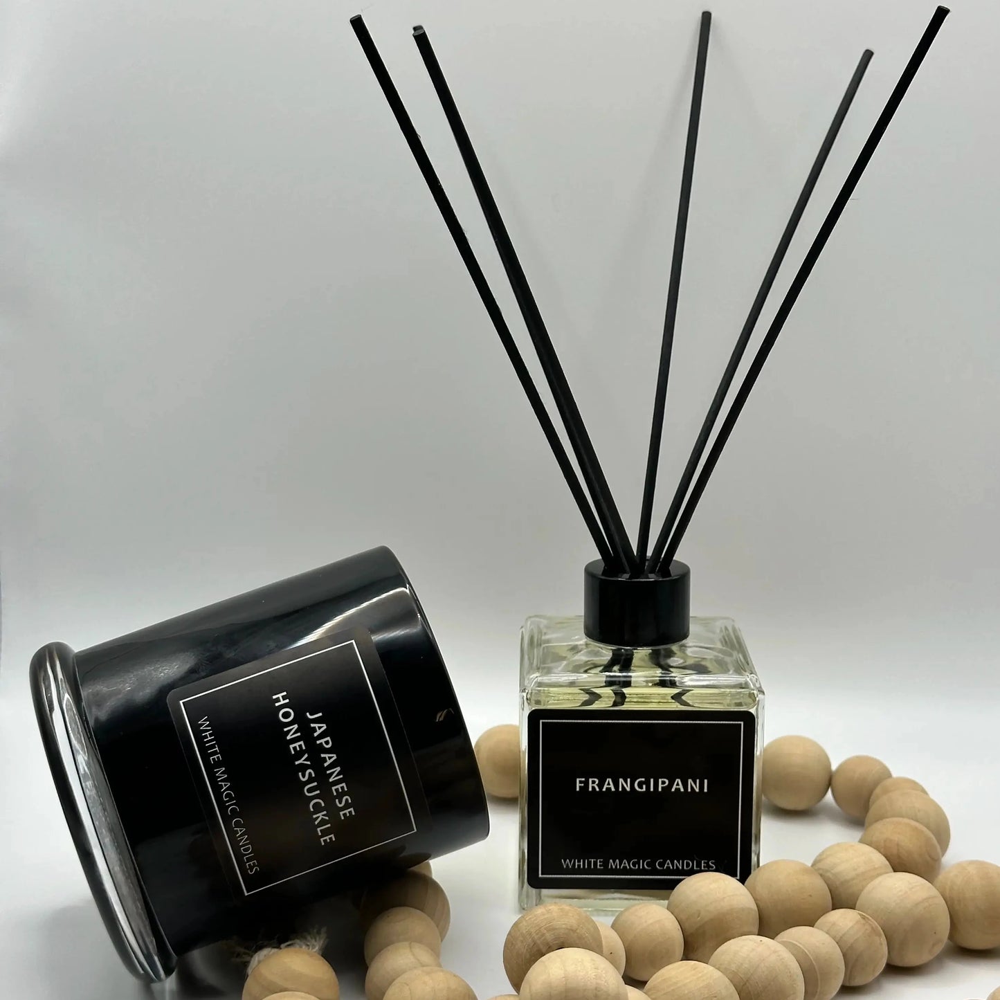 Black Sqaure box reed diffuser bottle with a white label reading "FRANGIPANI" - WMC