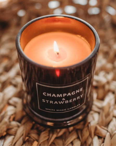 Scented Soy Candle burning front view in black jar