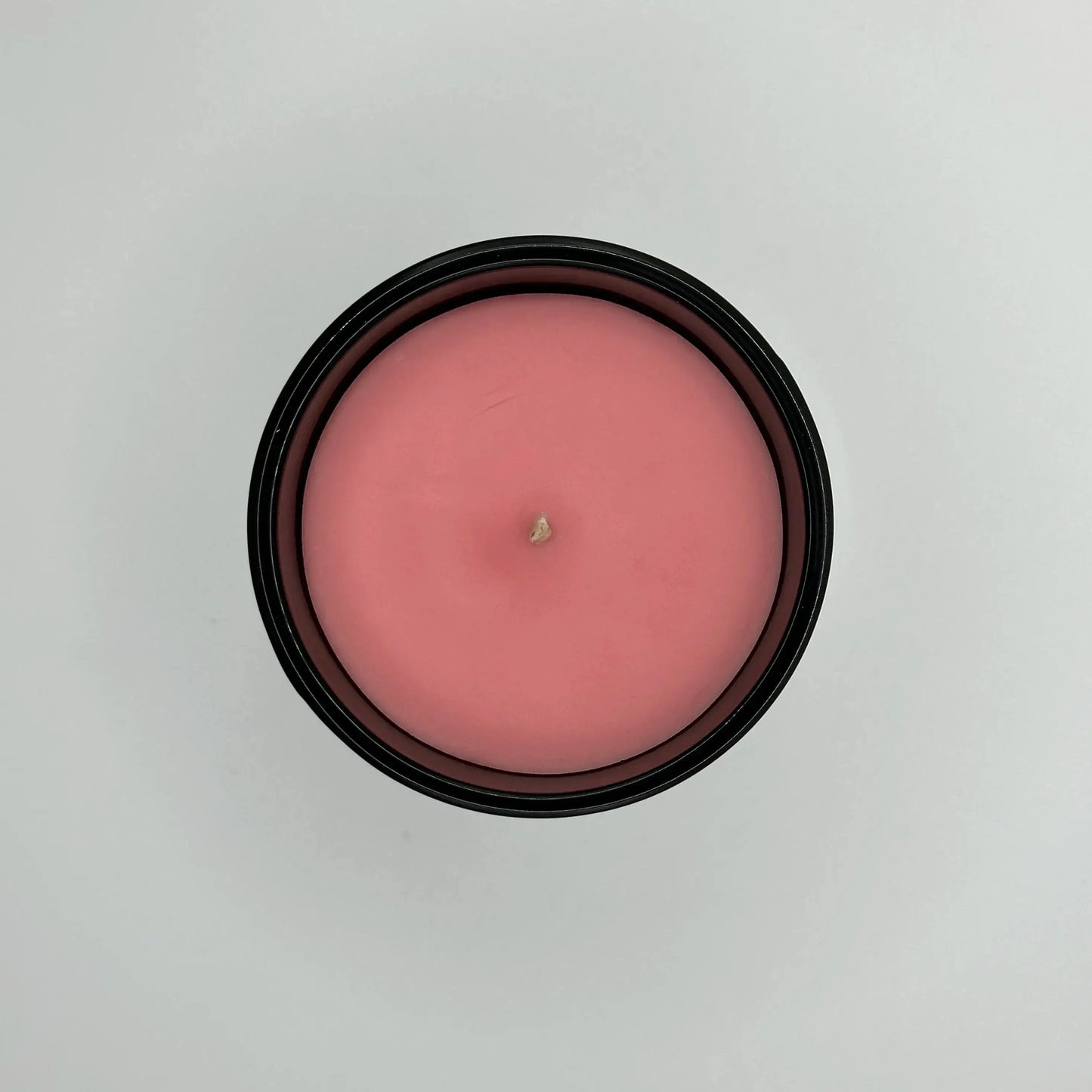 Buy soy wax candles in a pink candle with a black glass jar