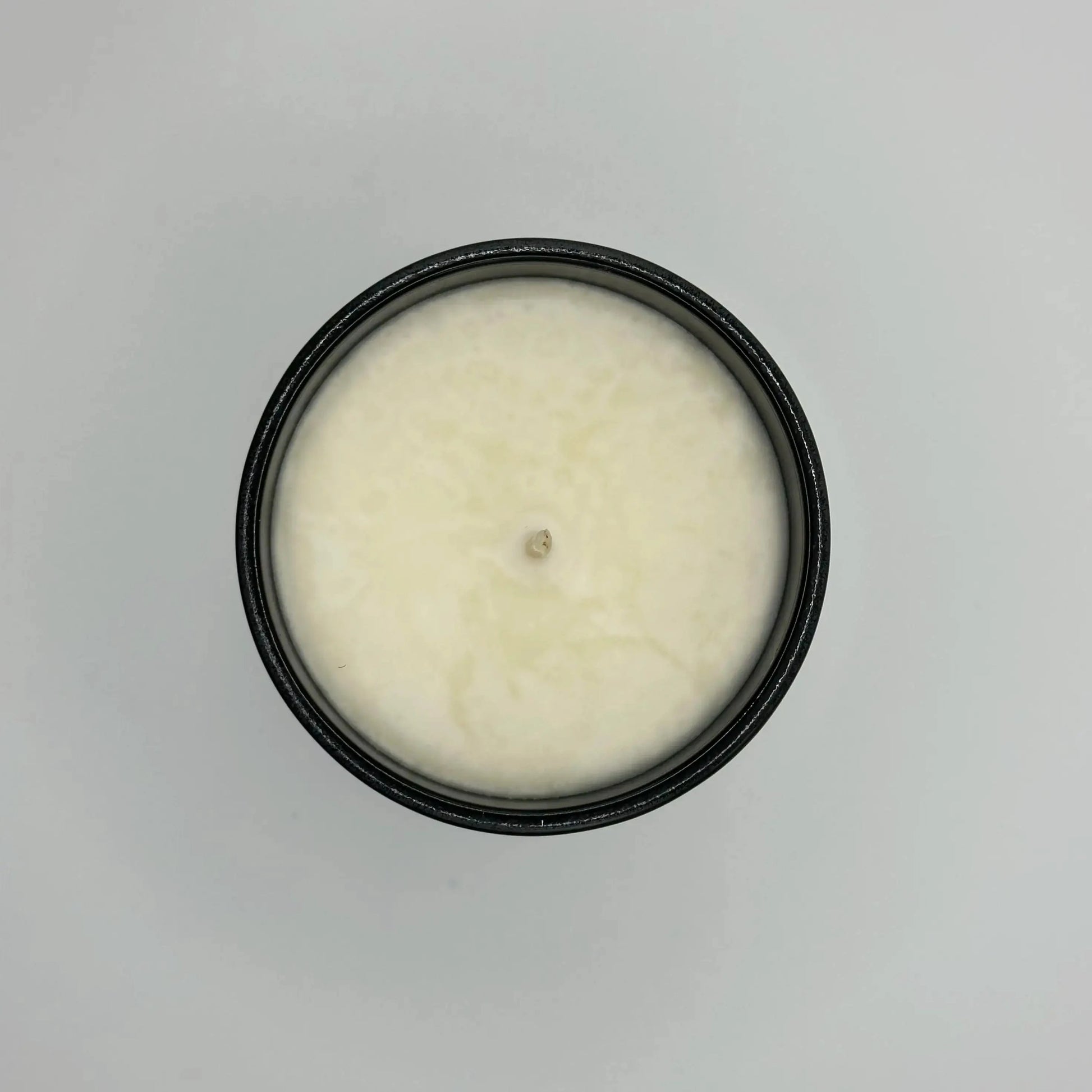  soy wax candles in a white candle with a black glass jar 